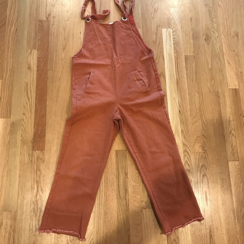 Rust colored overalls.